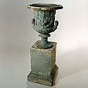 PAIR OF WEATHERED URNS